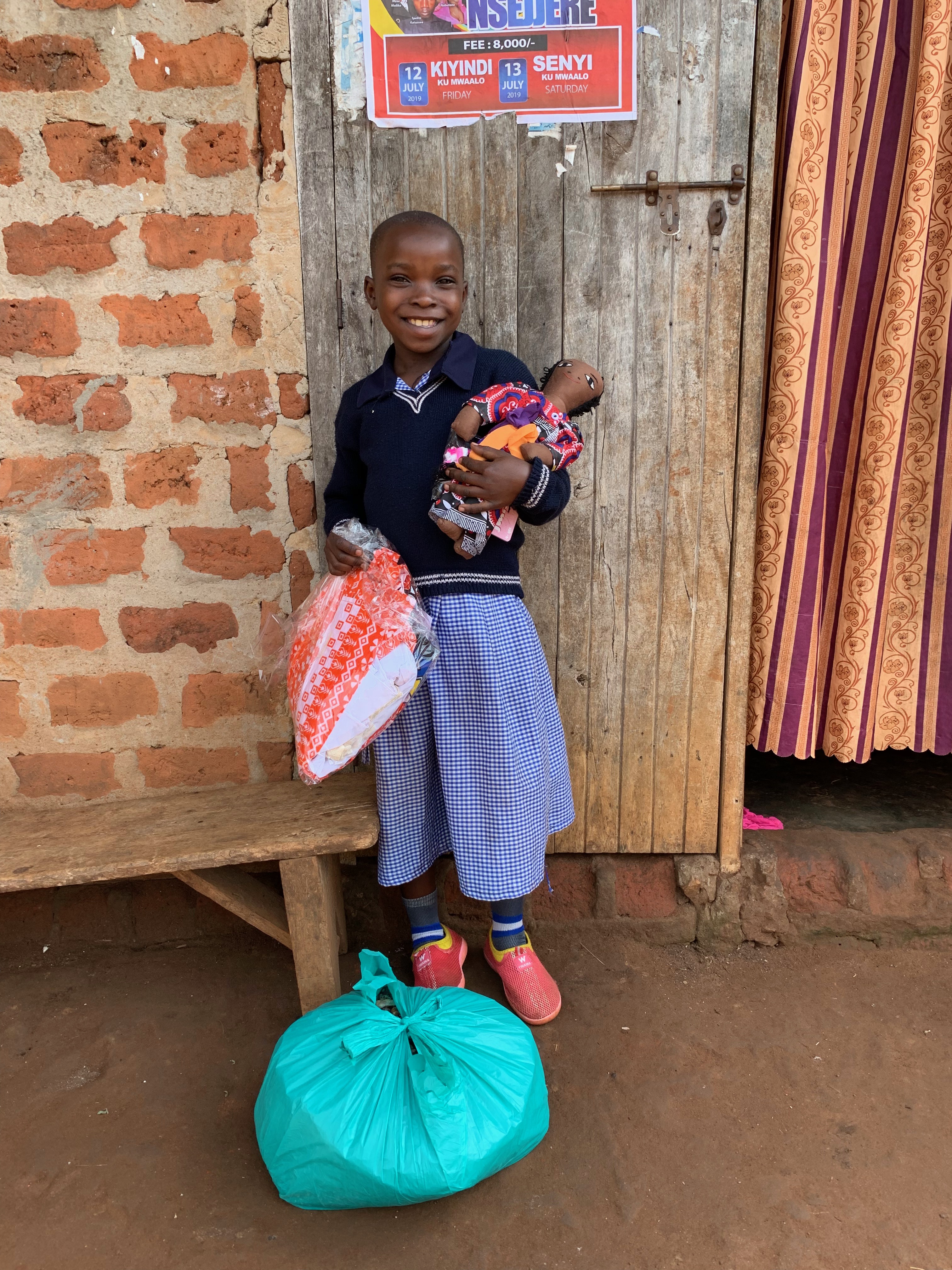Namutebi Fedelensi - 2019-2 - Photo Care item delivery of beans, clothing, doll